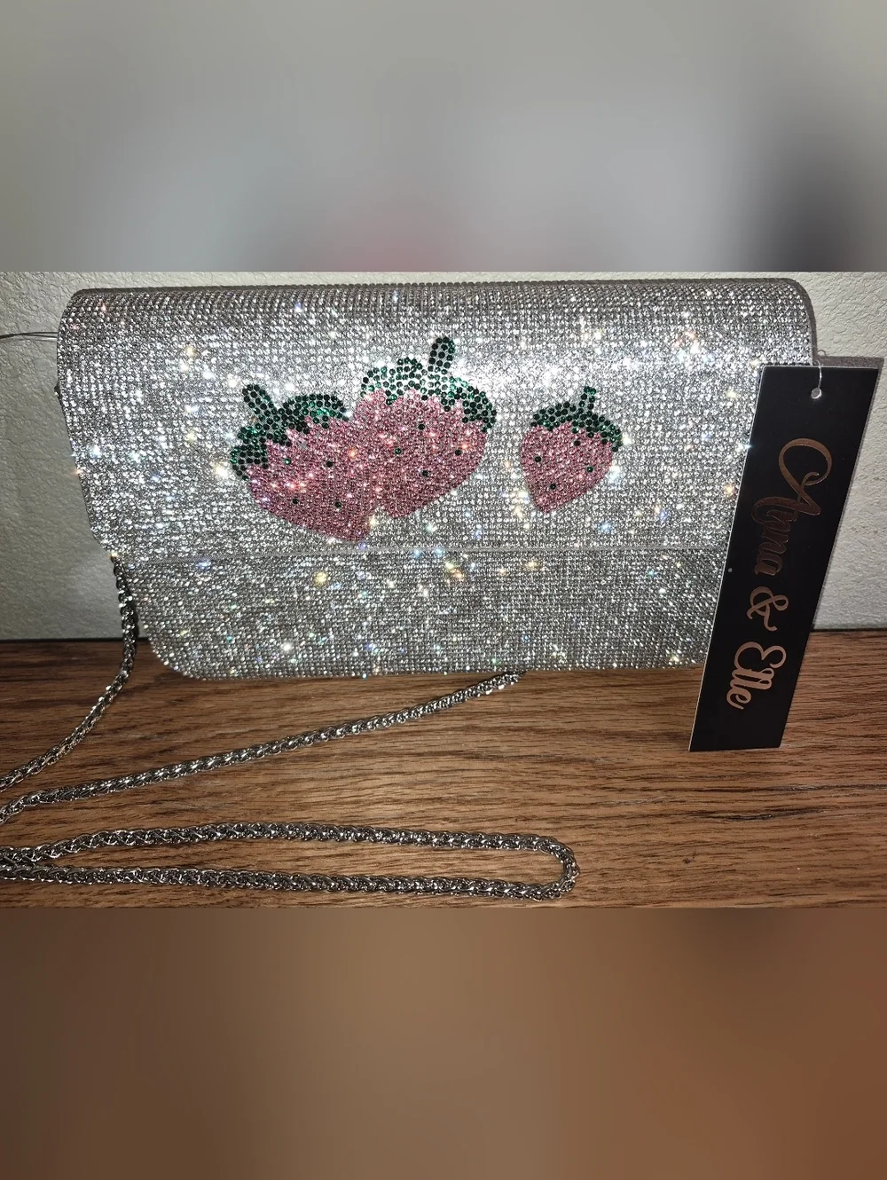 NWT's Rhinestone-encrusted silver clutch from the brand Anna & Elle, Strawberry